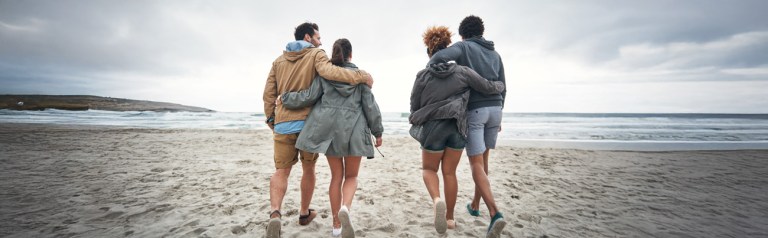 couples on a double date at the beach where perhaps they might talk about marriage